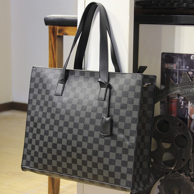 Gray checkered handbag with black handles
shoulder briefcase
executive business bag
men's office bag
laptop carrying case
stylish work briefcase
durable business bag
travel briefcase