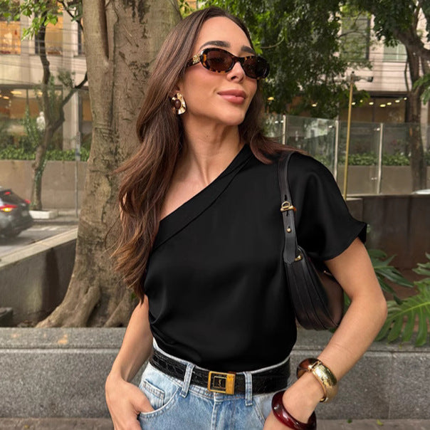 Woman wearing a black top and sunglasses outdoors
chic elegant blouses
women's fashion blouse
elegant women's top
stylish blouse
office wear blouse
casual chic top