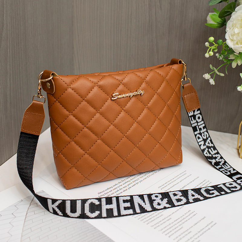 Brown quilted handbag with a black strap
stylish clutch bag
designer-inspired clutch
party clutch purse
chic shoulder clutch
trendy women's handbag
